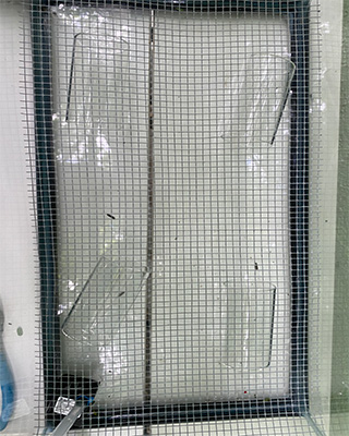 Glass cups underneath mesh layer
